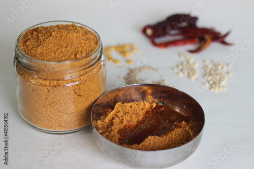 Idli podi or milagai podi is a dry vegan condiment served with idlis or dosa. Basically idli milagai podi is a dry powder made with lentils and red chilies. photo