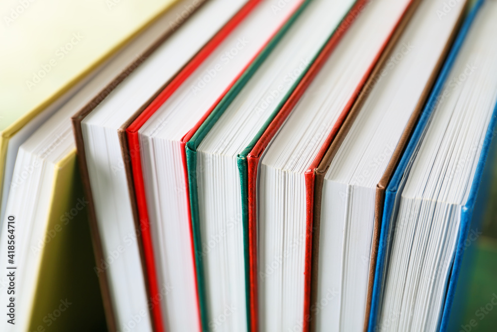 Stack of books on color background, closeup Stack of books on color background, closeup