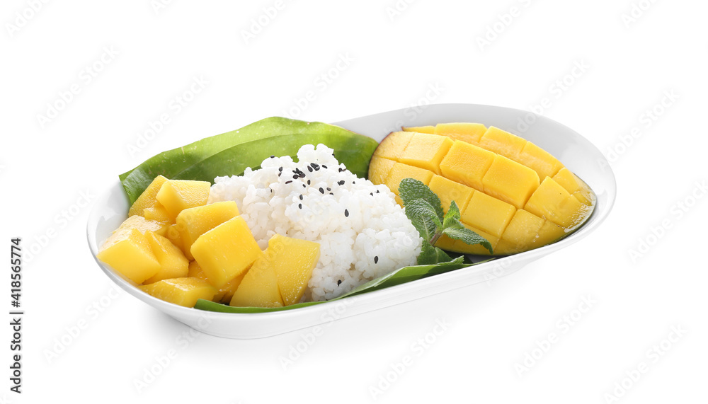 Plate with tasty rice and mango on white background