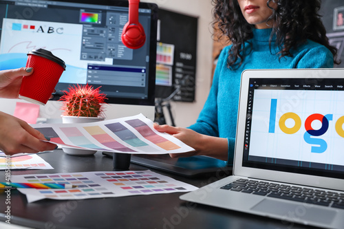 Female designer with collea...