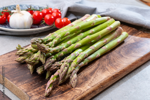 Bunch of fresh ripe green asparagus vegetables ready to cook or grill