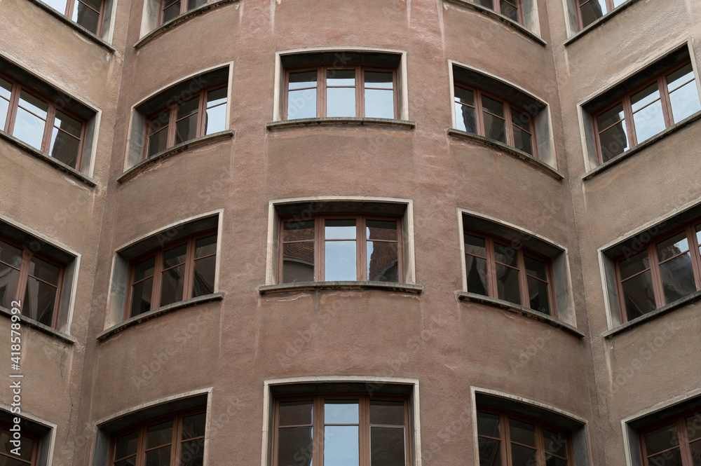 Architectural detail of a building from the inner courtyard, Windows are seen symmetrically Architectural detail of a building from the inner courtyard, Windows are seen symmetrically