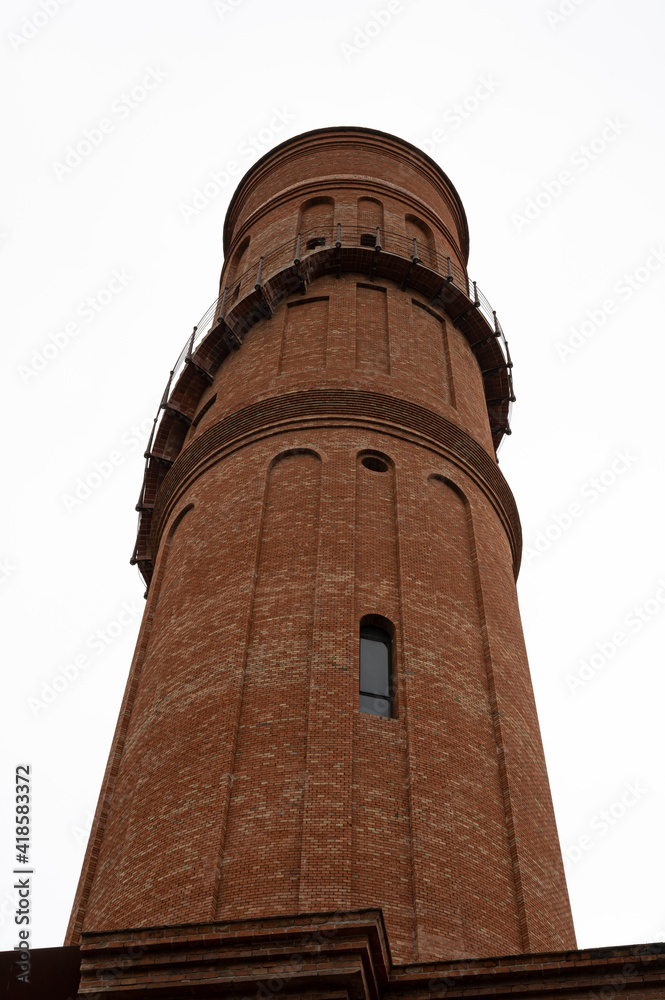 Old brick tower seen from below, close-up view