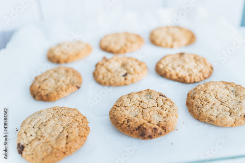 Oatmeal broun homemade cookies on white table. Healhy desserts, diet