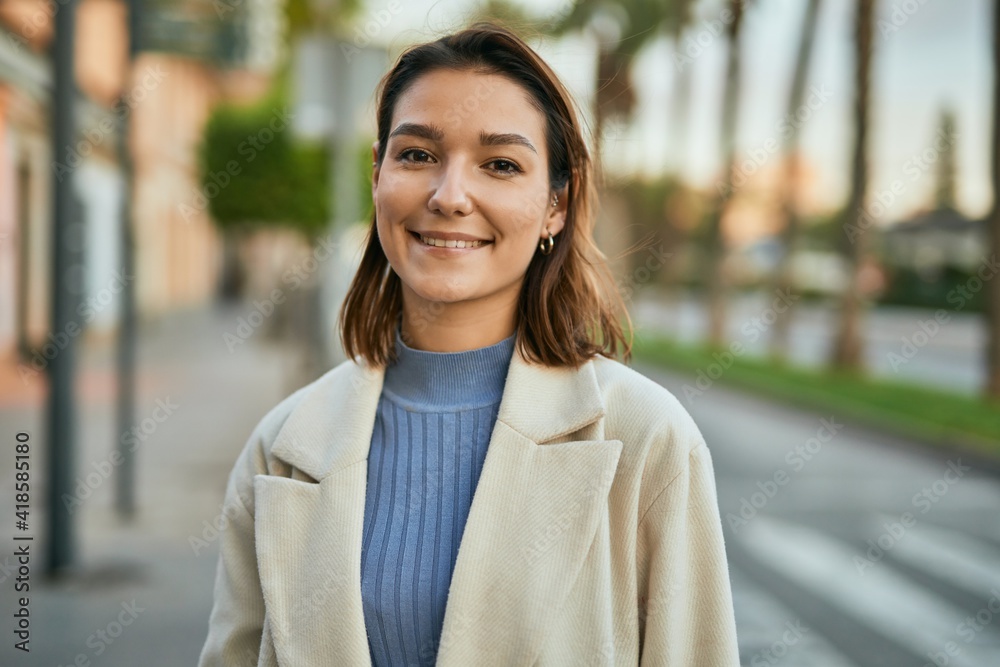 Young hispanic woman smiling happy standing at the city Young hispanic woman smiling happy standing at the city