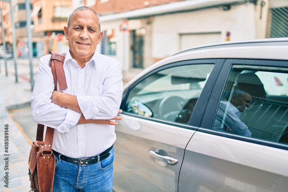 Senior man smiling happy standing over car at the city. Senior man smiling happy standing over car at the city.
