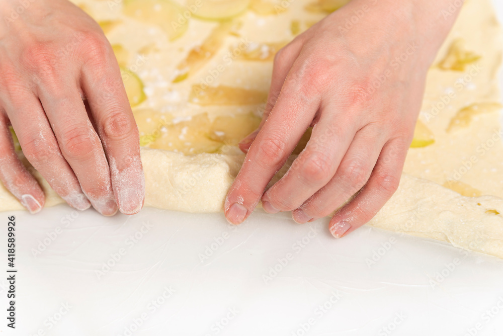 Chef prepares an apple roll. Process of making an apple dessert. Chef prepares an apple roll. Process of making an apple dessert.