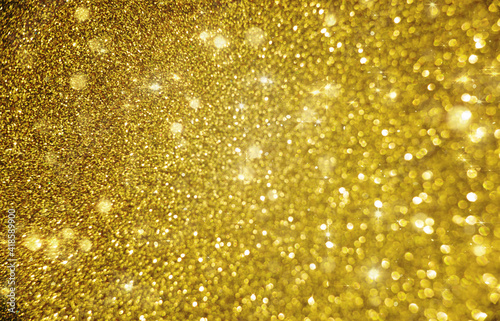 Golden twinkle abstract background with bokeh defocused lights
