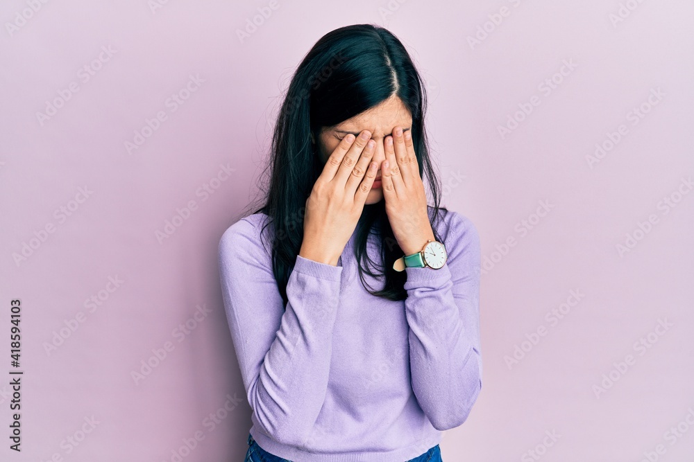 Young hispanic woman wearing casual clothes rubbing eyes for fatigue and headache, sleepy and tired expression. vision problem Young hispanic woman wearing casual clothes rubbing eyes for fatigue and headache, sleepy and tired expression. vision problem