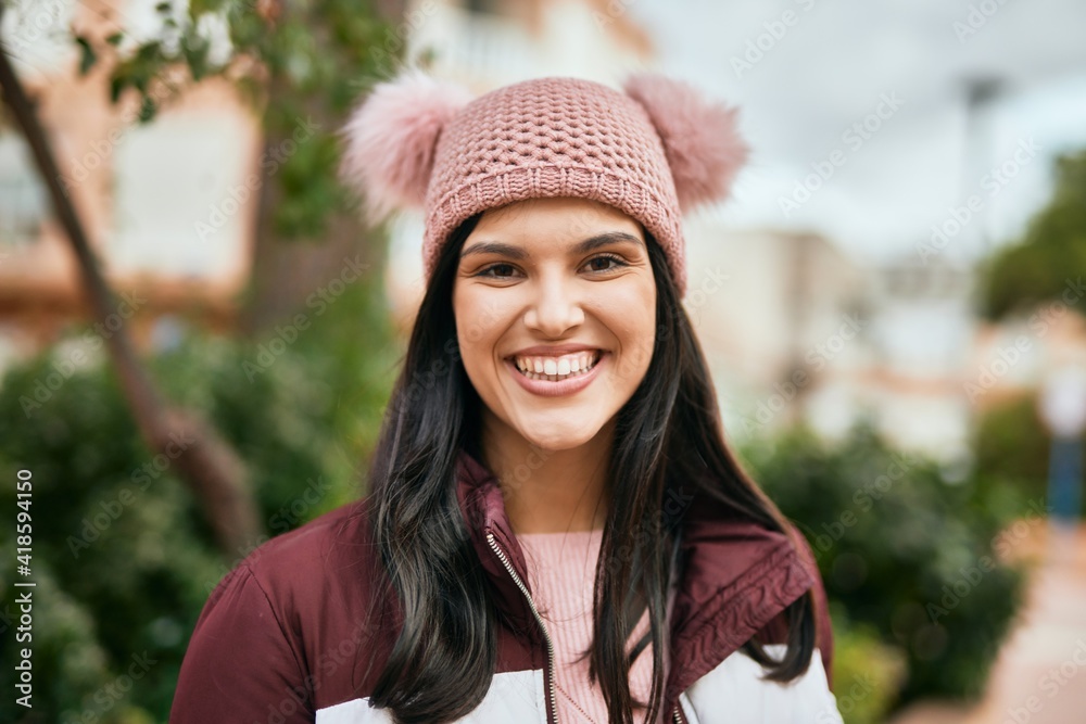 Young hispanic girl smiling happy standing at the city. Young hispanic girl smiling happy standing at the city.
