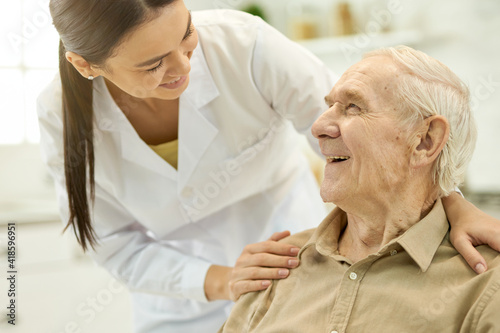 Trusted medical personnel acting supportive towards senior patient