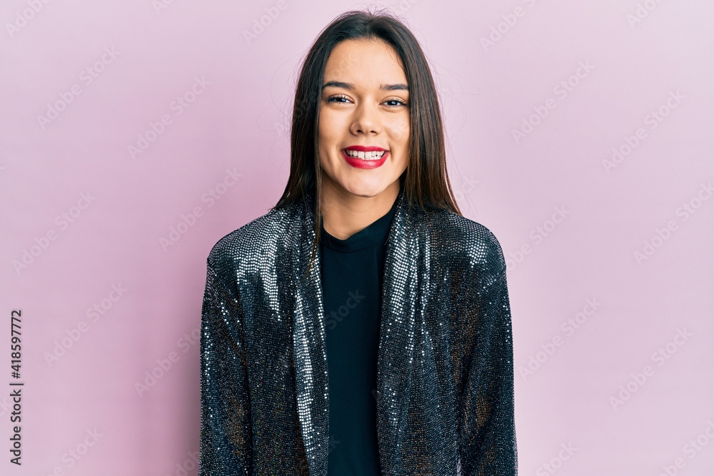 Fototapeta premium Young hispanic girl wearing party jacket with a happy and cool smile on face. lucky person.