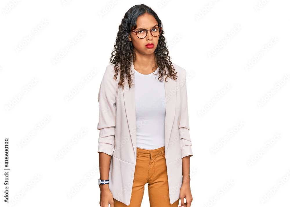 Young african american girl wearing business clothes skeptic and nervous, frowning upset because of problem. negative person. Young african american girl wearing business clothes skeptic and nervous, frowning upset because of problem. negative person.