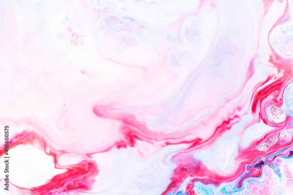 Fluid art. Abstract colorful background, wallpaper. Liquid marbling background. Mixed blue and light pink paints. Trendy colorful backdrop