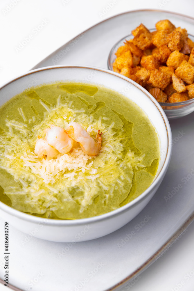 Photo of soup creme with shrimps parmesan and crackers Photo of soup creme with shrimps parmesan and crackers