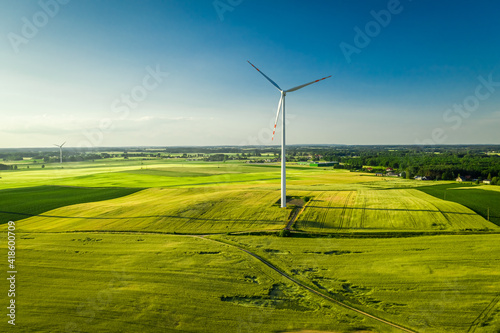 Wind turbine on field. Alternative energy in Poland. Aerial view