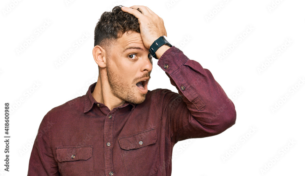 Young hispanic man wearing casual clothes surprised with hand on head for mistake, remember error. forgot, bad memory concept. Young hispanic man wearing casual clothes surprised with hand on head for mistake, remember error. forgot, bad memory concept.