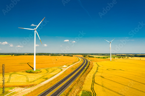 Aerial view of highway and wind turbines. Alternative energy, Poland.