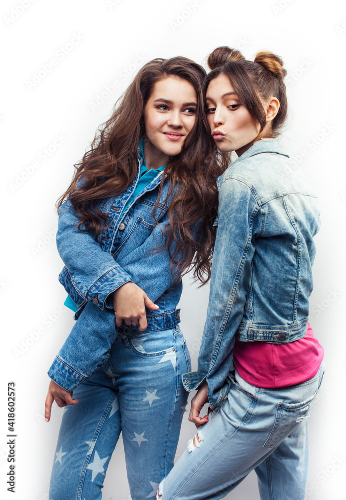 lifestyle and people concept: Fashion portrait of two stylish sexy girls best friends, over white background. Happy time for fun lifestyle and people concept: Fashion portrait of two stylish sexy girls best friends, over white background. Happy time for fun