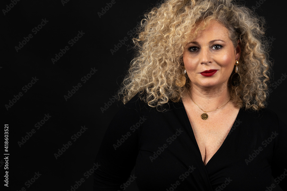Fototapeta premium portrait of mature woman plus size model, xxl woman on black background