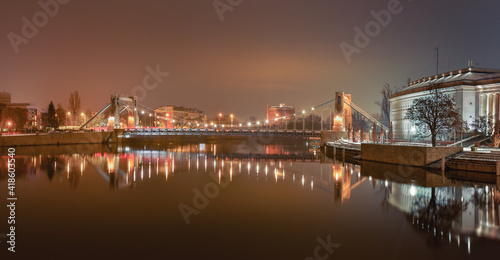 Grunwaldzki Bridge in Wroclaw on the Odra River, illuminated at night.