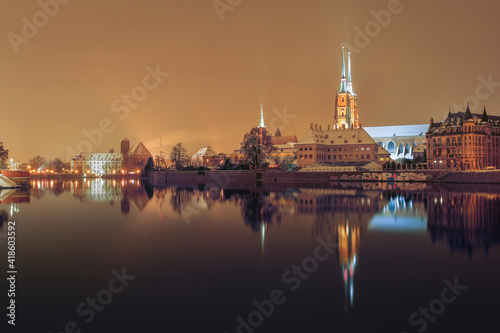 Cathedral of St. John the Baptist in Wroclaw on the Odra River, illuminated at night.