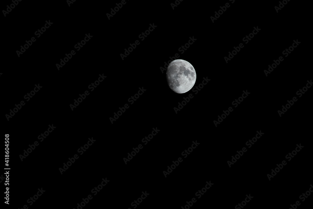 The first quarter of the moon in the sky. The first quarter of the moon in the sky.