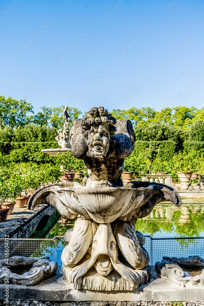 A statue in the Isolotto, an oval-shaped island with the Fountain of the Ocean in the middle, in Boboli Gardens, beside Palazzo Pitti, Florence city center, Tuscany region, Italy