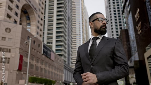 Wallpaper Mural Serious Young Man In Business Suit On Background Of The City. Tall Buildings Dubai. Confident Businessman. Torontodigital.ca