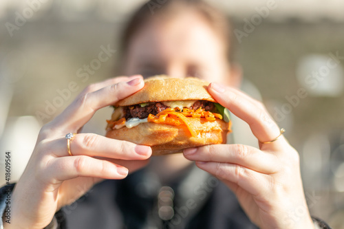 person eating a burger