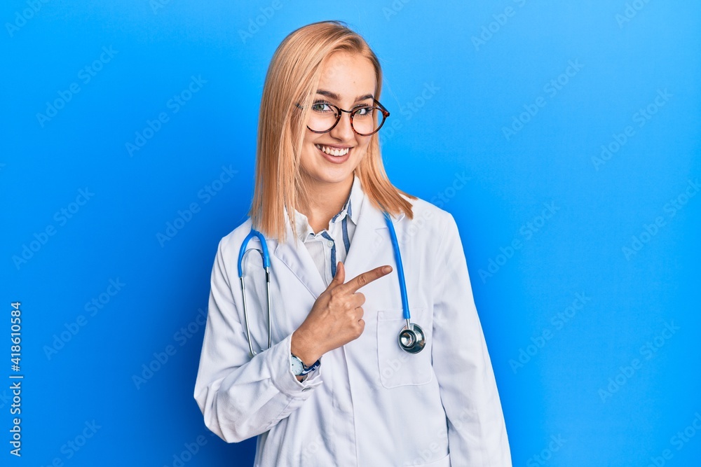 Beautiful caucasian woman wearing doctor uniform smiling cheerful pointing with hand and finger up to the side Beautiful caucasian woman wearing doctor uniform smiling cheerful pointing with hand and finger up to the side