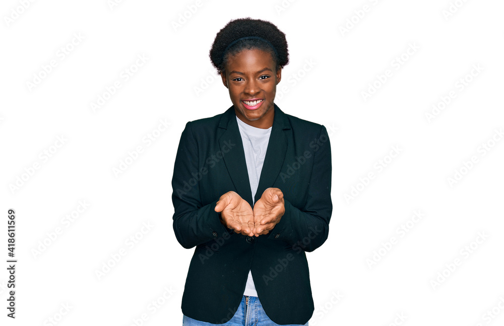 Young african american girl wearing business clothes smiling with hands palms together receiving or giving gesture. hold and protection