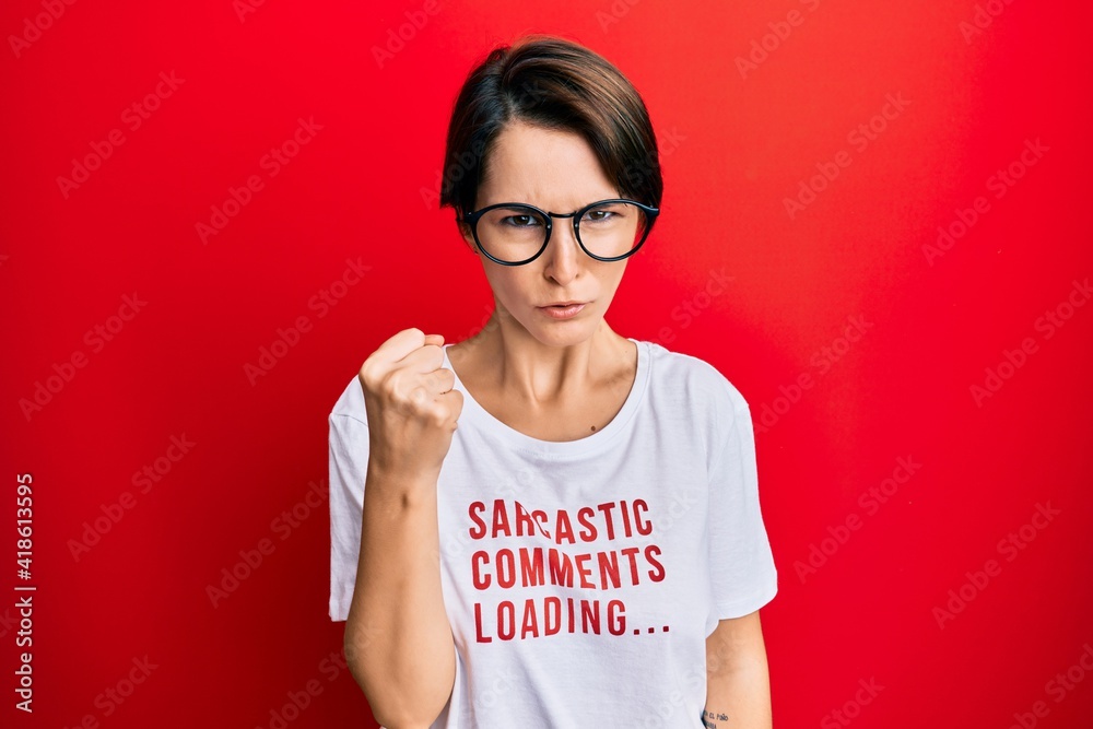 Young brunette woman with short hair wearing sarcastic comments loading t-shirt annoyed and frustrated shouting with anger, yelling crazy with anger and hand raised Young brunette woman with short hair wearing sarcastic comments loading t-shirt annoyed and frustrated shouting with anger, yelling crazy with anger and hand raised
