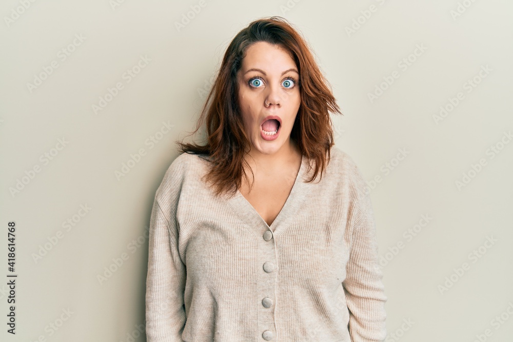 Young caucasian woman wearing casual clothes afraid and shocked with surprise and amazed expression, fear and excited face. Young caucasian woman wearing casual clothes afraid and shocked with surprise and amazed expression, fear and excited face.