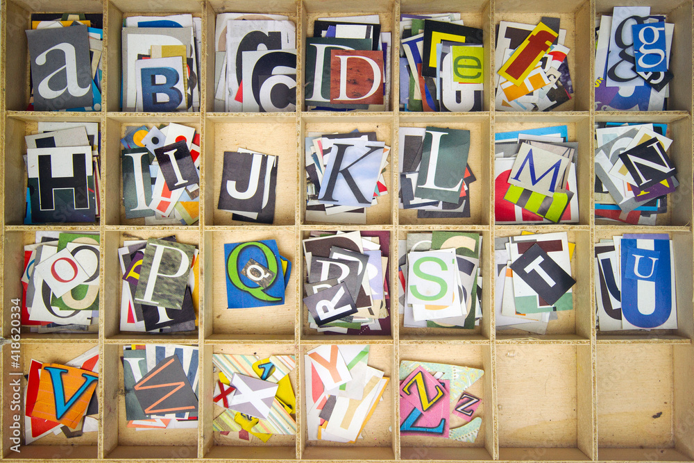 Alphabet with cut out magazine letters from above Alphabet with cut out magazine letters from above