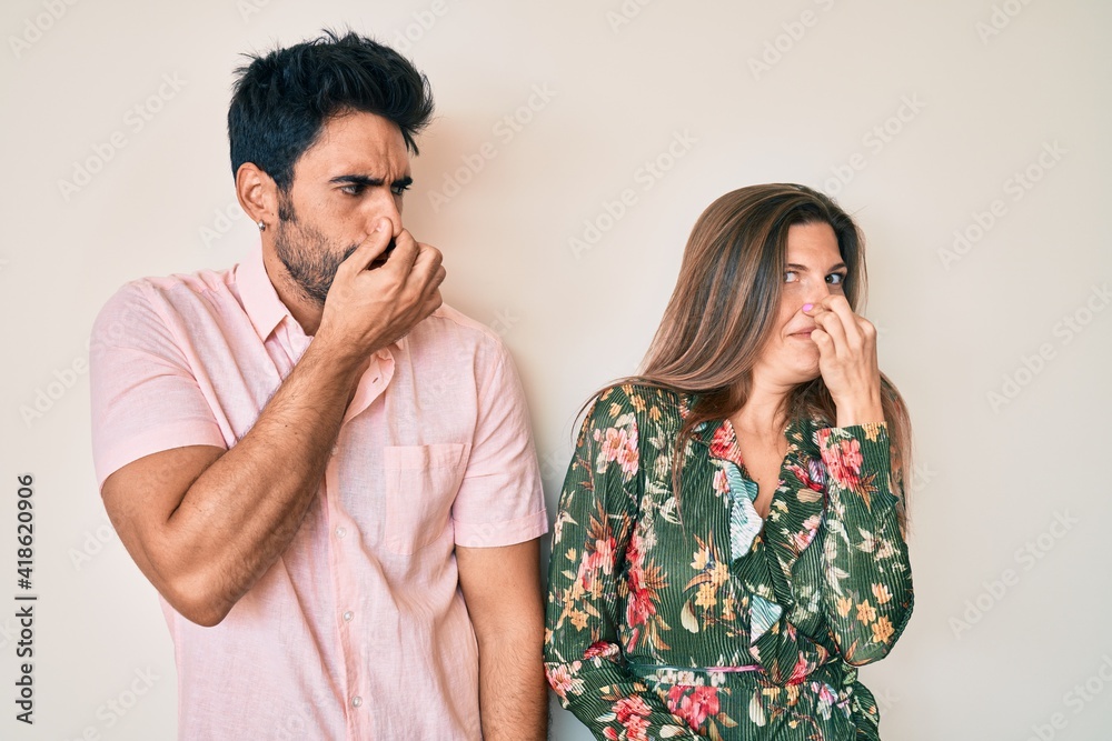 Beautiful young couple of boyfriend and girlfriend together smelling