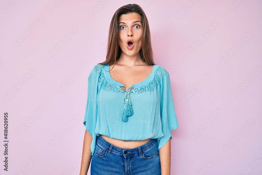 Beautiful caucasian woman wearing casual clothes afraid and shocked with surprise expression, fear and excited face. Beautiful caucasian woman wearing casual clothes afraid and shocked with surprise expression, fear and excited face.
