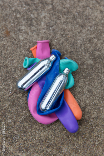 Nitrous oxide metal bulbs or laughing gas recreational drug use photo