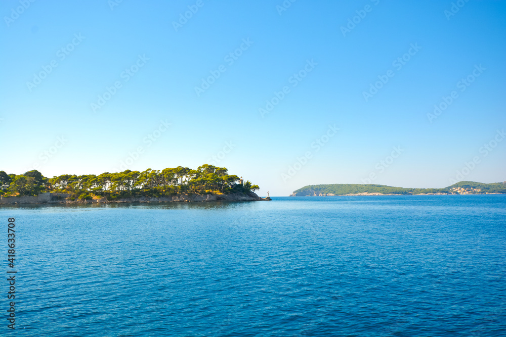Two lighthouses on the coast of the island of Daksa near Dubrovnik on the Dalmatian Coast of Croatia.