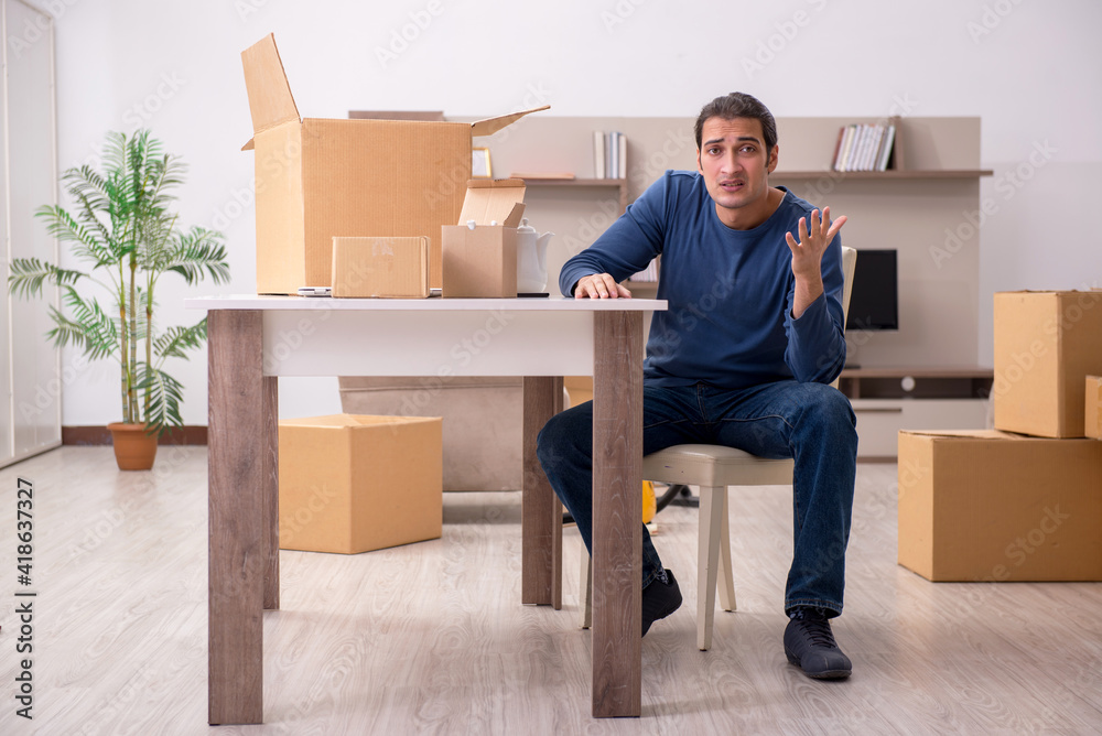 Fototapeta premium Young man moving to new flat