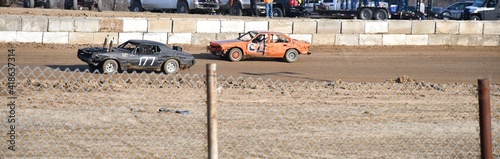 Race Cars on a Dirt Track photo