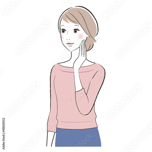 A woman touching her face