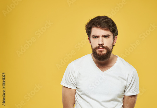 Wallpaper Mural Portrait of handsome man yellow background beard brunette model Torontodigital.ca