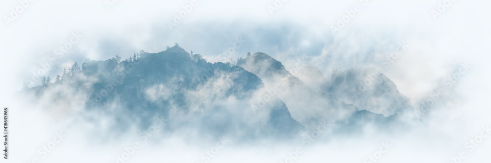 Mountain peaks in the clouds, vignette. Panoramic view. - obrazy, fototapety, plakaty 