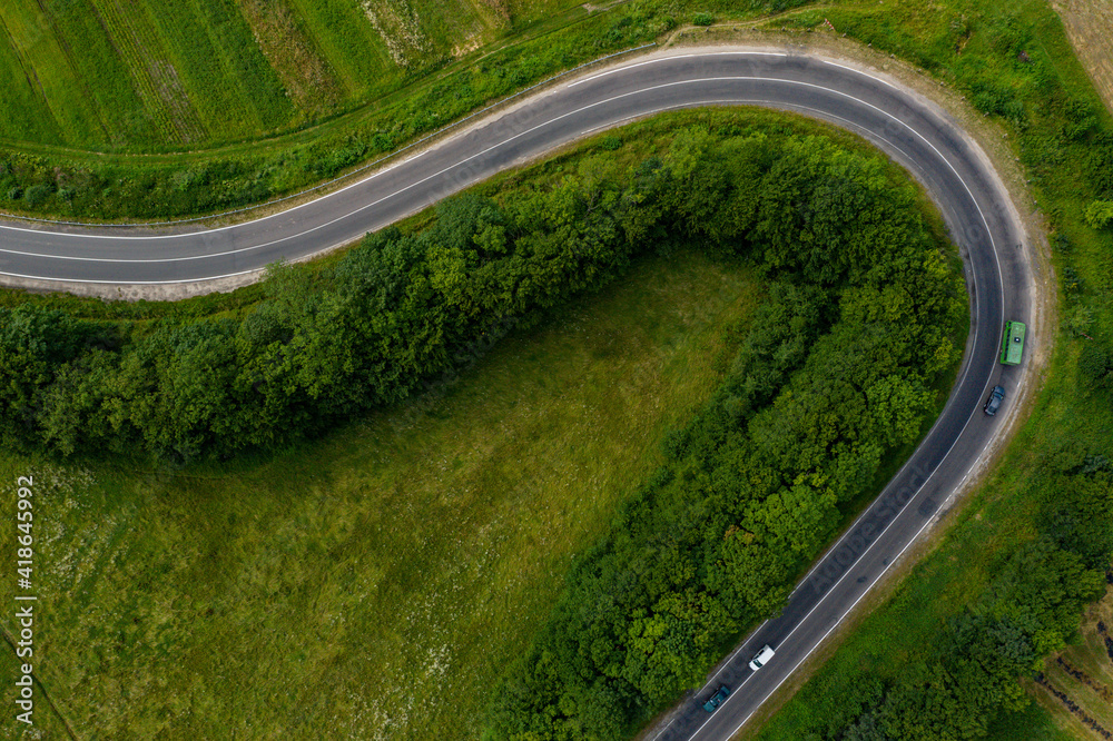 Winding road and dangerous turns, serpentine roads from a bird's eye view.