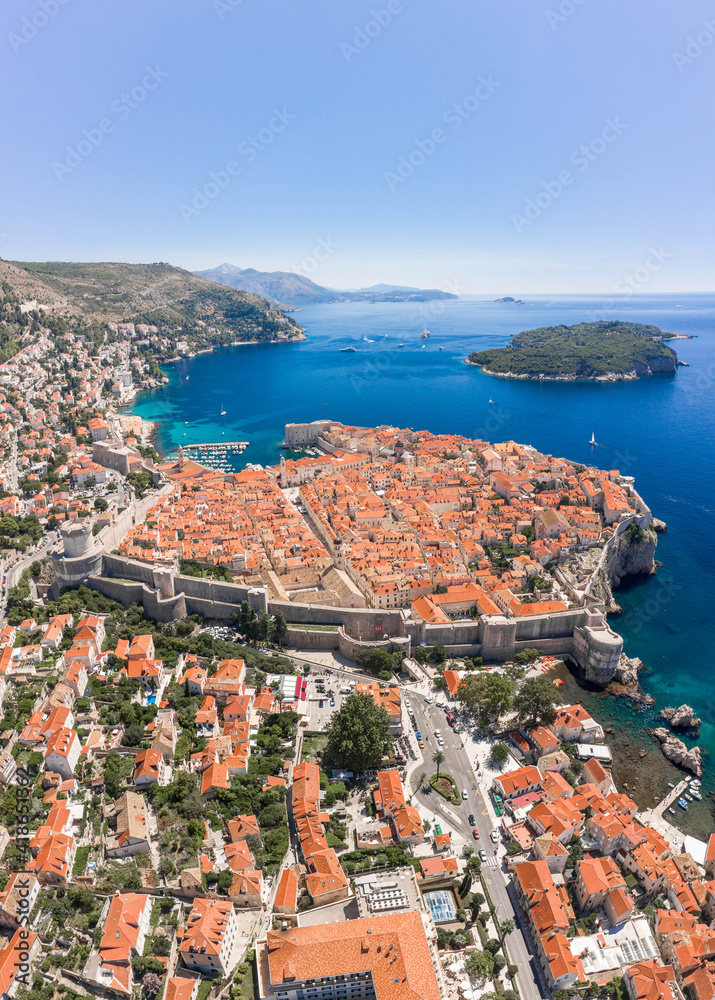 Aerial drone shot of Otok Lokrum in Adriatic sea near Dubrovnik old town in Croatia summer noon