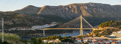 Panorama view of Dubrovnik bridge with mountain ranga Dalamatia coast in Croatia summer photo