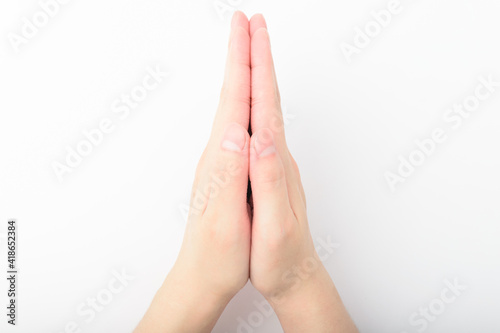 Praying hands on white background