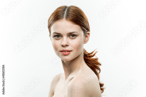 pretty woman makeup on face naked shoulders gathered hair attractive look