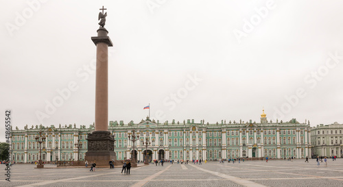 Tourists at the Palace Square in the rain photo